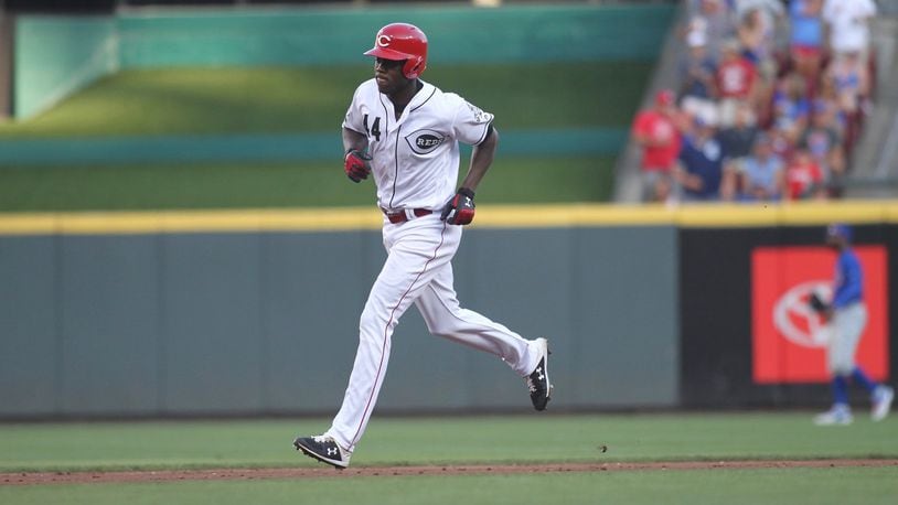 The Reds’ Aristides Aquino rounds the bases after a two-run home run in the second inning against the Cubs on Friday, Aug. 9, 2019, at Great American Ball Park in Cincinnati. David Jablonski/Staff
