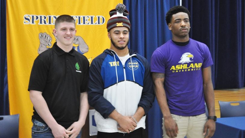 Springfield High School seniors (from left) Zach Breslin, Tavion Smith and C.J. McDavid signed to play college football on Wednesday, Feb. 6, 2019. NICK DUDUKOVICH / CONTRIBUTED