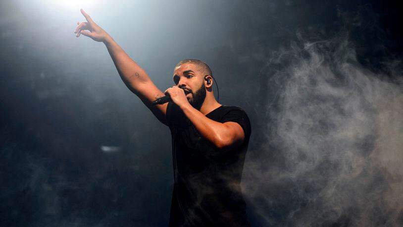 FILE - In this June 27, 2015 file photo, Canadian singer Drake performs on the main stage at Wireless festival in Finsbury Park, London. All 25 tracks from Drake's ultra-popular "Scorpion" album, released on June 29, are on the Billboard Hot 100 chart. (Photo by Jonathan Short/Invision/AP, File)