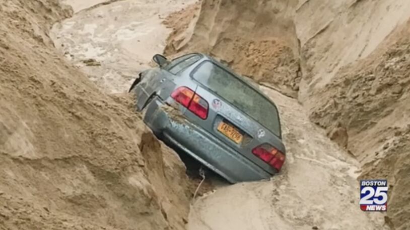 Heavy rains caused a car to fall into a sand bank. (Photo: WFTV.com)