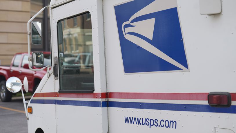 United States Postal Service logo on delivery vehicle outside the post office, Sept. 20, 2023, in Deadwood, S.D. (AP Photo/David Zalubowski)