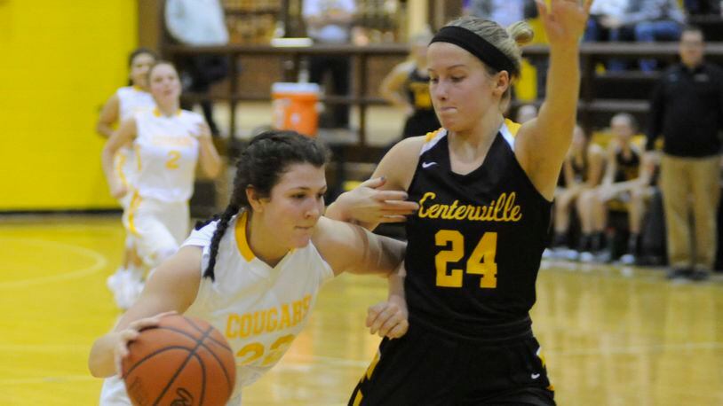 Kenton Ridge’s Mallery Armentrout (with ball) is confronted by Centerville’s Kelsey George. Centerville defeated host Kenton Ridge 61-46 in a girls high school basketball game on Thursday, Jan. 3, 2019. MARC PENDLETON / STAFF