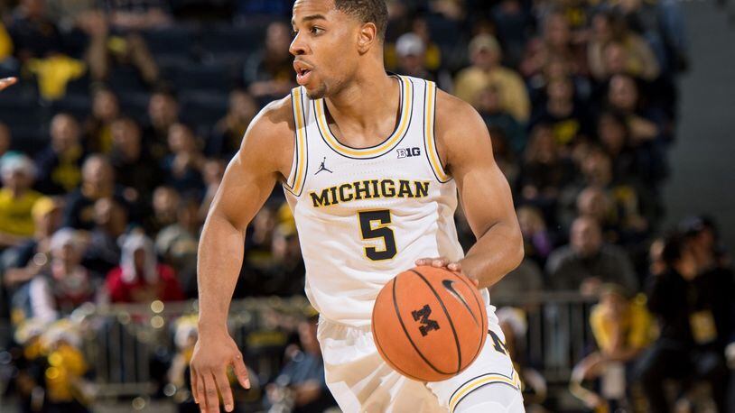 Alter High School grad Jaaron Simmons was a backup guard for Michigan in the 2017-18 season that ended with an appearance in the NCAA national championship. MICHIGAN PHOTOGRAPHY