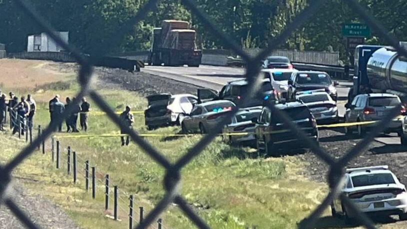 This image provided by KEZI 9 News shows the scene on Interstate 5 on Tuesday, April 23, 2024, near Eugene, Ore., after a former Washington state police officer wanted after killing two people, including his ex-wife, was found with a self-inflicted gunshot wound following a chase in Oregon, authorities said. His 1-year-old baby, who was with him, was taken safely into custody by Oregon State Police troopers. (KEZI 9 News via AP)
