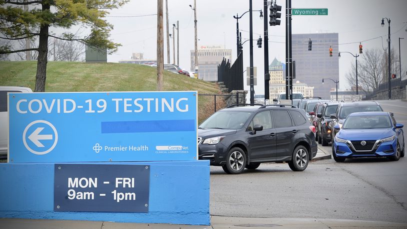 Cars waiting in line for COVID testing at the old Montgomery County fairgrounds stretched down N. Main Street to the ER entrance of Miami Valley Hospital Monday Dec. 27, 2021.