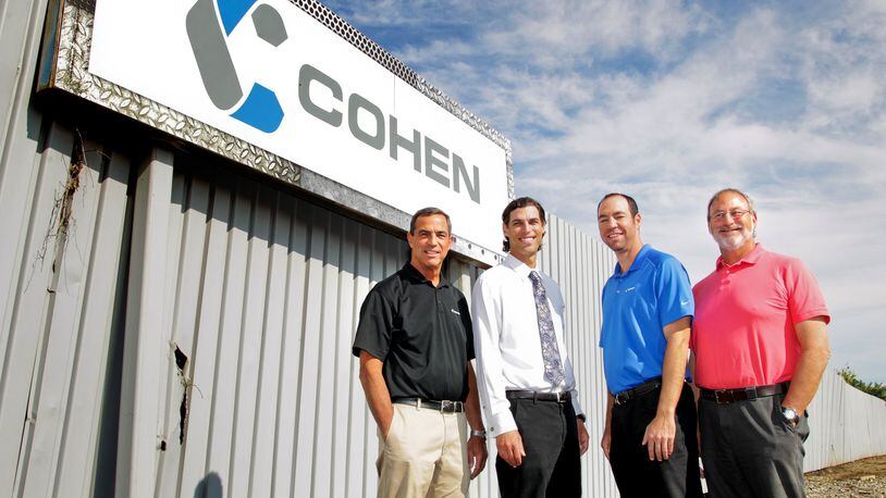 From left, Ken Cohen, Andy Cohen, Adam Dumes and Neil Cohen stand outside Cohen Recycling in Middletown Thursday, Aug. 15, 2013. NICK DAGGY / STAFF