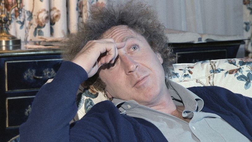 FILE - In a Dec. 9, 1977 file photo, actor Gene Wilder is shown during an interview with Jean Claude Bouis at his New York City Hotel. Wilder’s nephew said Monday, Aug. 29, 2016, that the actor and writer died late Sunday at his home in Stamford, Connecticut, from complications from Alzheimer’s disease. He was 83. (AP Photo/Richard Drew, File)