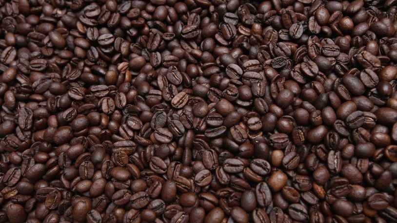Freshly-roasted espresso coffee beans sit to cool. (Photo by Sean Gallup/Getty Images)