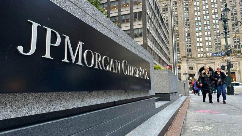 FILE - Pedestrians approach JPMorgan Chase headquarters on Dec. 29, 2023, in New York. JP Morgan reports earnings on Friday, April 12, 2024. (AP Photo/Peter Morgan, File)