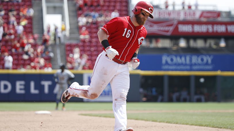 Tucker Barnhart of the Reds rounds the bases after a solo home run in the sixth inning of a game against the Marlins at Great American Ball Park on last Saturday. The Reds defeated the Marlins 6-3.
