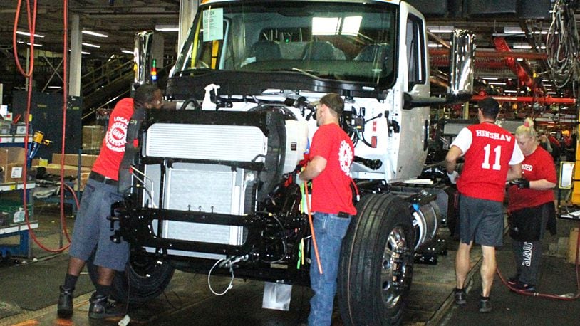 Navistar International employees put together a truck on the assembly line. JEFF GUERINI/STAFF September21 2018