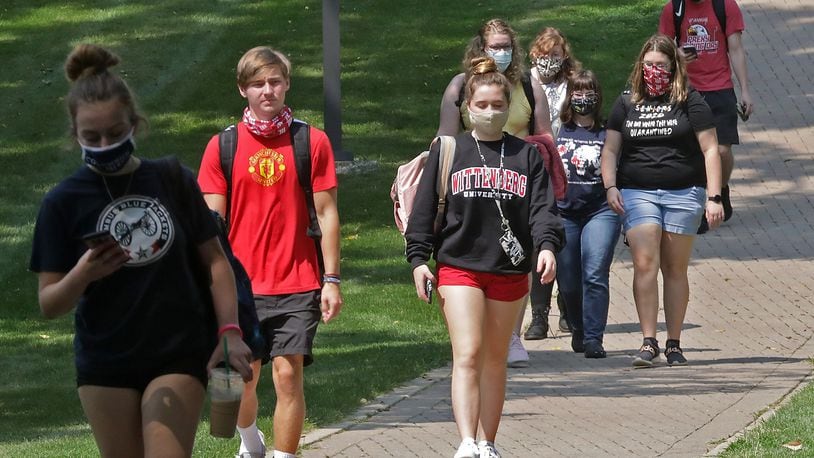 Wittenberg University students walk across campus Tuesday. BILL LACKEY/STAFF