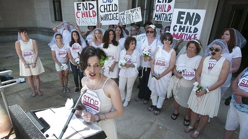 Fraidy Reiss, director of the nonprofit group Unchained At Last speaks at a protest June 1 of New Jersey Gov. Chris Christie’s veto of a bill that would have prevented the marriage of any female under 18. Protesters wore veils and put tape over their mouths in opposition to the veto. (Photo by Michael Mancuso, NJ.com).