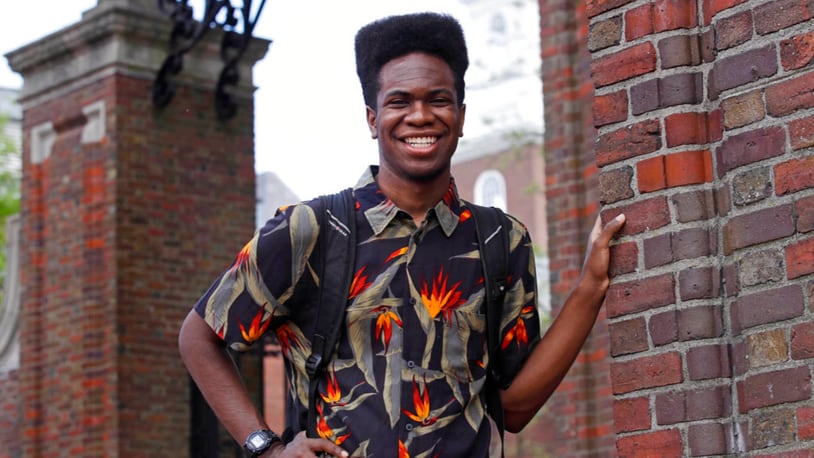 Obasi Shaw poses outside the gates of Harvard Yard in Cambridge, Mass., Thursday, May 18, 2017. Shaw, an English major who graduates from Harvard next week, is the university's first student to submit his final thesis in the form of a rap album. The record, called âLiminal Minds,â has earned the equivalent of an A- grade, good enough to ensure that Shaw will graduate with honors at the universityâs commencement next week.  (AP Photo/Charles Krupa)