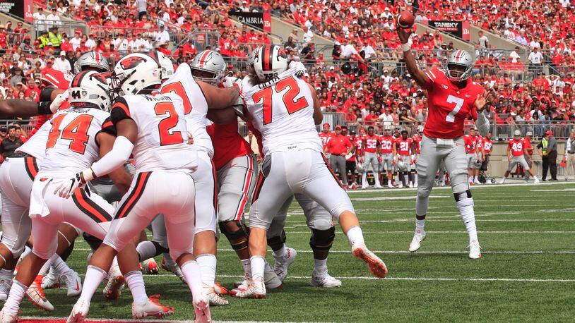 Ohio State’s Dwayne Haskins throws a touchdown pass to Terry McLaurin in the first quarter against Oregon State on Saturday, Sept. 1, 2018, at Ohio Stadium in Columbus. David Jablonski/Staff
