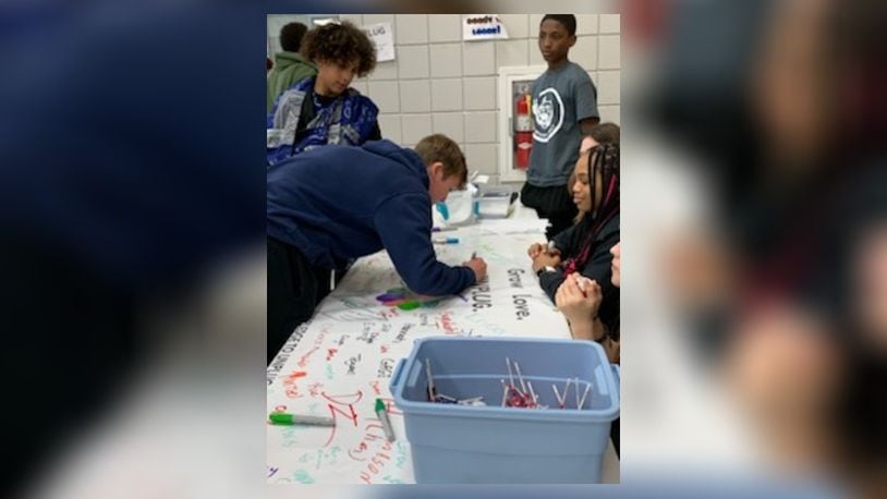 Roosevelt Middle School students sign up to participate in National Day of Unplugging, lasting from sundown Friday to sundown Saturday. They pledge to leave their electronic devices off during the 24 hours and concentrate on interacting with family and others.