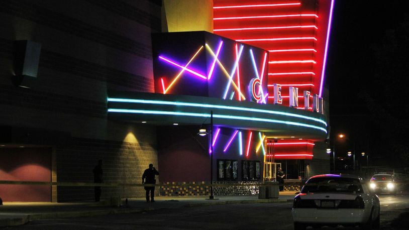 In a July 20, 2012, file photo, police stand outside the Century 16 movie theater in Aurora, Colorado. Gunman James Holmes walked into a midnight screening of "The Dark Knight Rises" and opened fire, killing 12 people and injuring another 70.