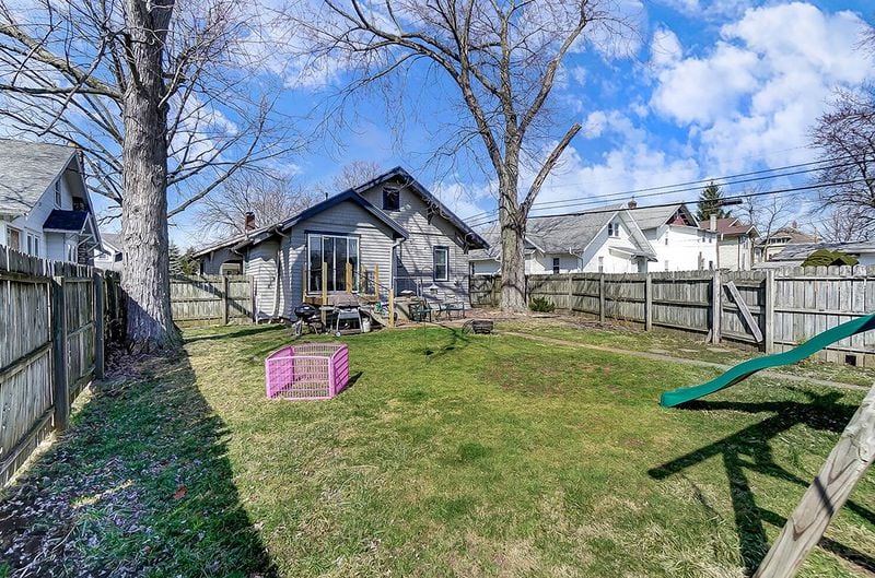 The back yard is fully surrounded by a privacy fence, has a wood deck off the kitchen breakfast area and a patio. There is access to the detached, 1-car garage at the rear of the yard. CONTRIBUTED PHOTO