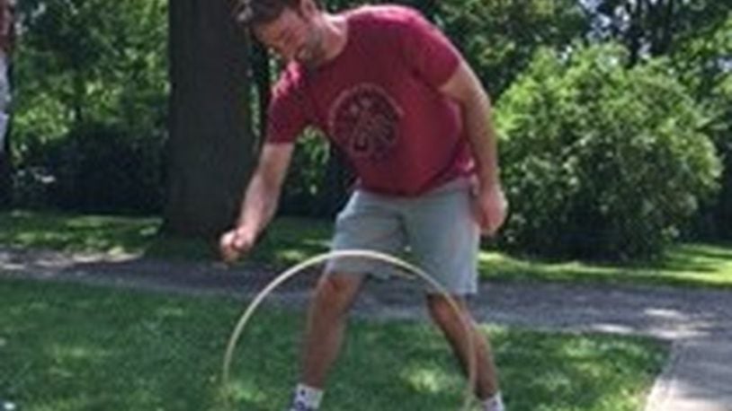Adam Gilmor of Wooster tries his hand at the old fashioned Hoop Game.