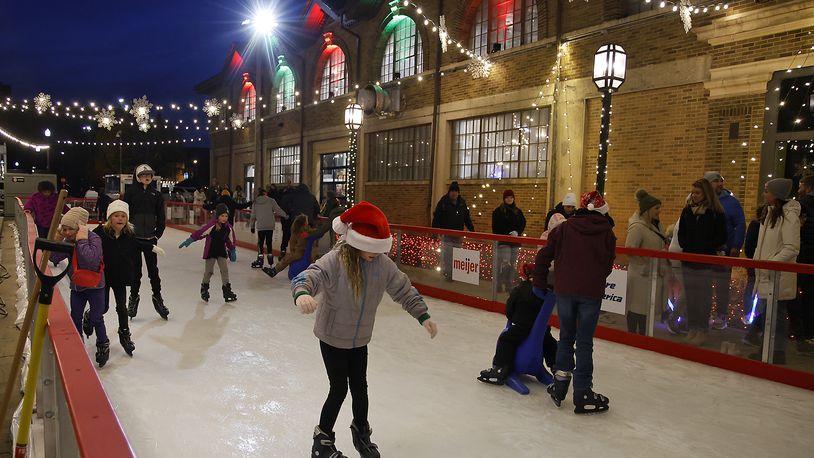 The city's outdoor ice skating rink opened for Springfield's Holiday in the City Grand Illumination Friday, Nov. 24, 2023. The annual lighting the city's Christmas tree and turning on of the holiday lights throughout downtown starts a month of activities in the downtown area. BILL LACKEY/STAFF