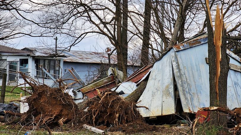 The tops of trees were snapped off and power lines damaged Monday afternoon, Feb. 27, 2023, along West Alexandria Road in Madison Twp., Butler County after a funnel cloud was spotted during a tornado warning issued by the National Weather Service in Wilmington. NICK GRAHAM/STAFF