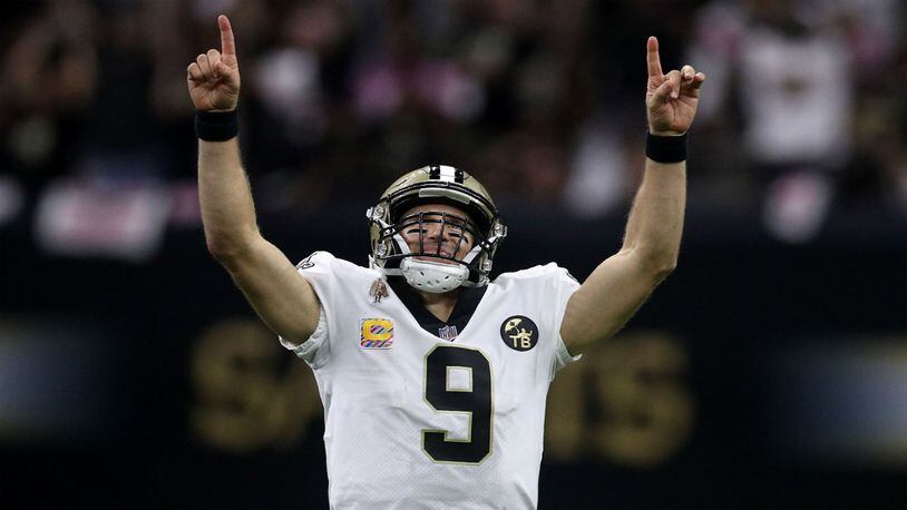 Drew Brees of the New Orleans Saints reacts after throwing a 62-yard pass to take the all-time yardage record against the Washington Redskins at Mercedes-Benz Superdome on October 8, 2018 in New Orleans, Louisiana.