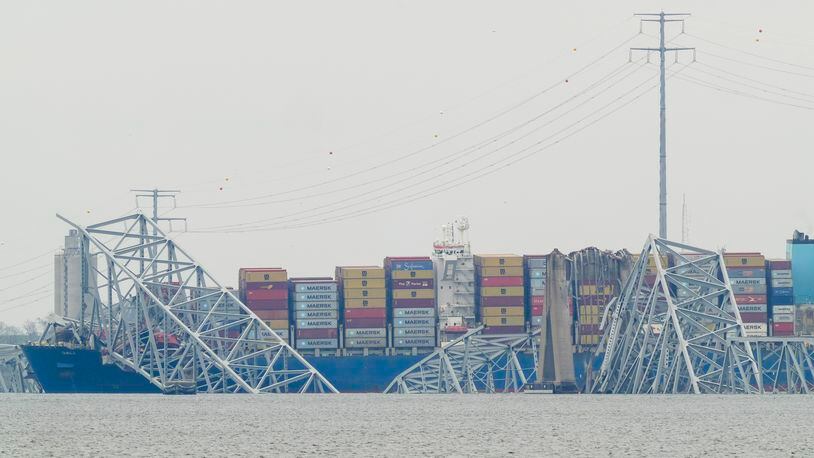 A container ship rests against the wreckage of the Francis Scott Key Bridge on Thursday, March 28, 2024, in Baltimore, Md. The ship rammed into the major bridge in Baltimore early Tuesday, causing it to collapse in a matter of seconds and creating a terrifying scene as several vehicles plunged into the chilly river below. (AP Photo/Matt Rourke)