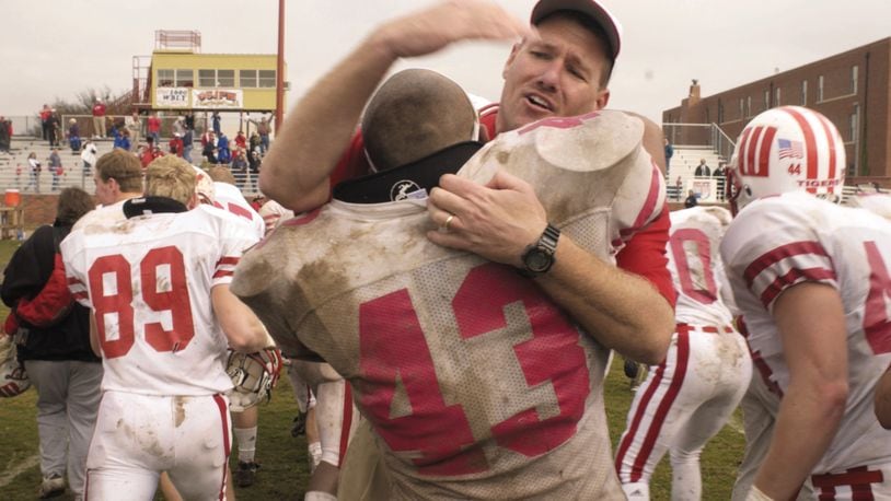 Wittenberg head coach Joe Finchams hugs linebacker Ryan Gresham following one of the biggest victories of his career, a 38-35 defeat of Hardin-Simmons in the first round of the NCAA Division III playoffs in 2001 in Abilene, Texas. Contributed photo