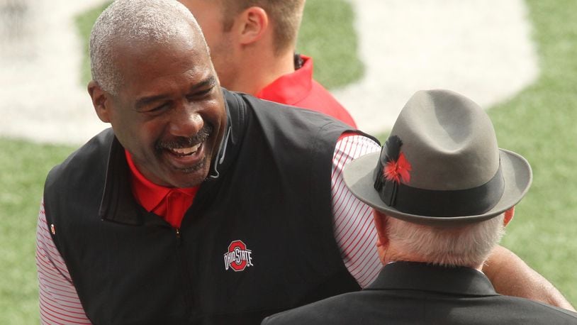 Ohio State Athletic Director Gene Smith smiles as he talks to former coach Earle Bruce before a game against Rutgers on Saturday, Oct. 1, 2016, at Ohio Stadium in Columbus. David Jablonski/Staff