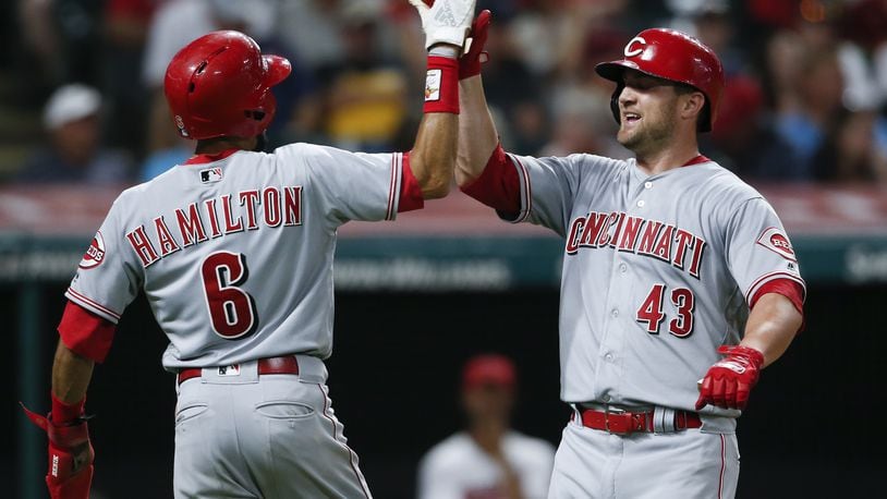 CLEVELAND, OH - JULY 09: Scott Schebler #43 of the Cincinnati Reds celebrates with Billy Hamilton #6 after hitting a two run home run off Josh Tomlin #43 of the Cleveland Indians during the ninth inning at Progressive Field on July 9, 2018 in Cleveland, Ohio. The Reds defeated the Indians 7-5. (Photo by Ron Schwane/Getty Images)