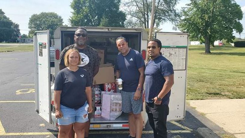 Ledra Boyd, Allen Moore, Rick Nance and Dion Green (left to right) loaded donations into a trailer to be delivered to hurricane victims in Louisiana. They are planning a second trip in October.