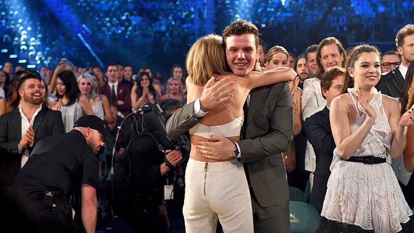 Musician Taylor Swift (L) embraces brother Austin Swift after winning the Top Artist award at the 2015 Billboard Music Awards at MGM Grand Garden Arena on May 17, 2015 in Las Vegas, Nevada. (Photo by Kevin Winter/BMA2015/Getty Images for dcp)