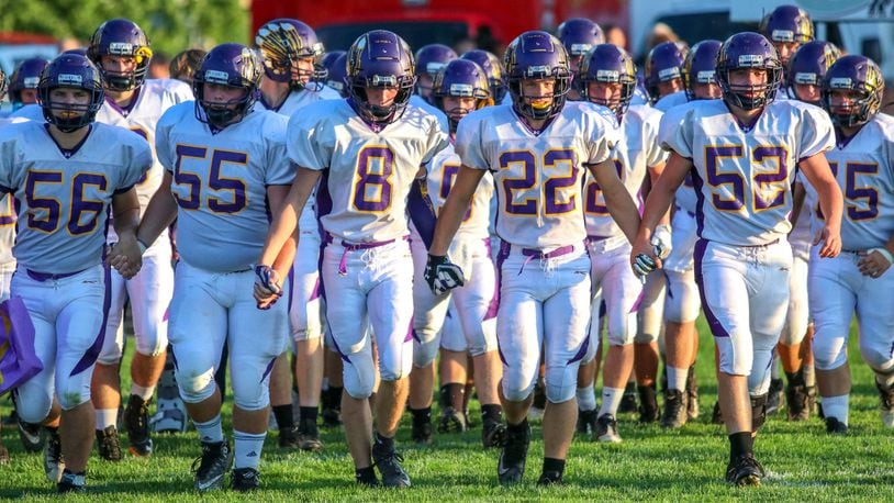 The Mechanicsburg High School football team walks onto the field before its game at Greeneview on Friday, Sept. 14, 2018. The Indians won the game 7-0. Michael Cooper/CONTRIBUTED