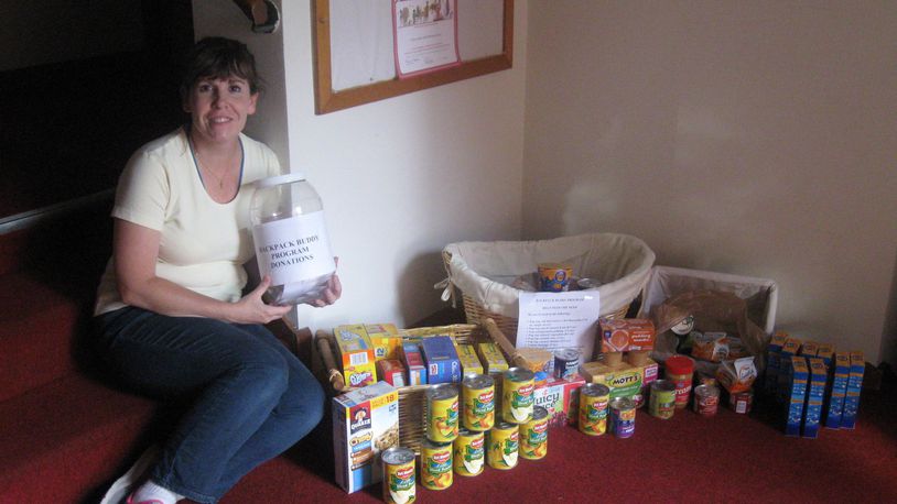 Jill Weubker accepting food and donations for the Backpack Buddies program. CONTRIBUTED