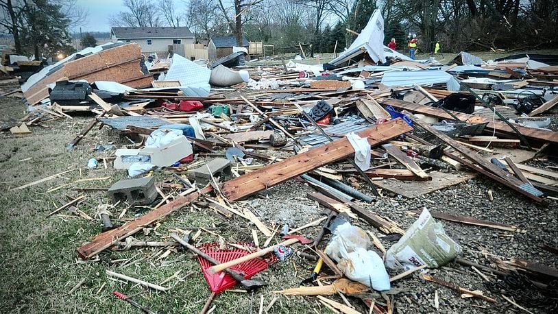 Debris of what used to be a pole barn covers the neighbor's back yard on Newlove Road after an early morning tornado Wednesday, February 28, 2024. MARSHALL GORBY \STAFF