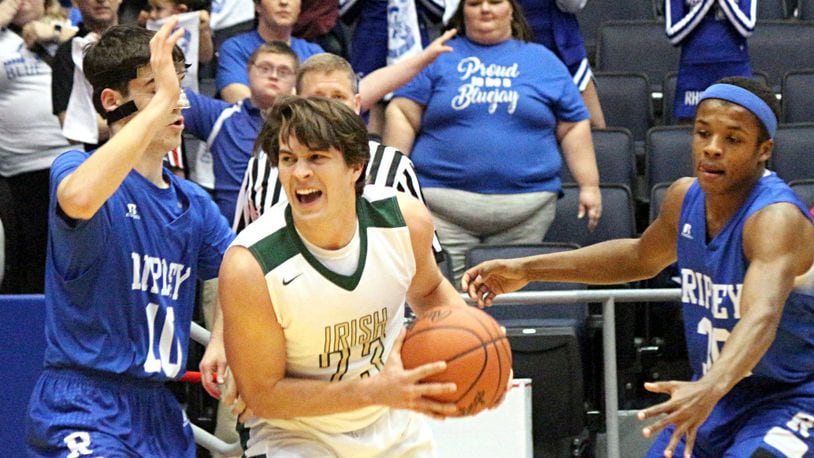 Catholic Central senior Dominic DeWitt (with ball) was among the many key baseball returners who helped the Irish make a deep basketball playoff run. GREG BILLING / CONTRIBUTED