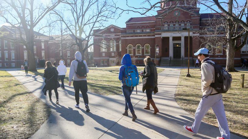 Students walk through the campus of Miami University in Oxford, Wednesday, Feb. 15, 2017. Enrollment at area colleges has dropped from 1 to 4 percent, due to various reasons, including more people going back to work with the improved economy. GREG LYNCH / STAFF