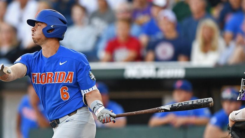 Florida third baseman Jonathan India hits a two run double against the LSU Tigers in the third inning during game one of the College World Series Championship Series on June 26, 2017 at TD Ameritrade Park in Omaha, Nebraska.  (Photo by Peter Aiken/Getty Images)