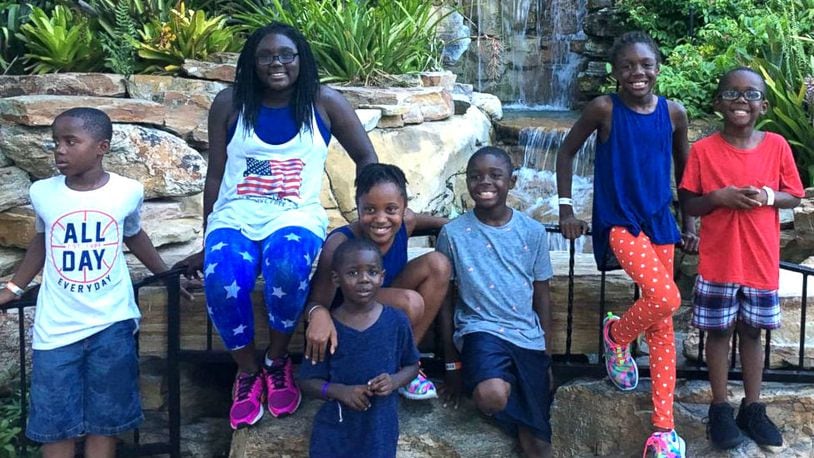 DaShoan and Sofia Olds, of Marianna, Fla., are adopting seven siblings - Necia, 12, Eric, 10, Erica, 10, Zavian, 9, Dava, 8, Keyon, 5, and Reggie, 4, - to keep them together. The siblings' adoption will become official in September.