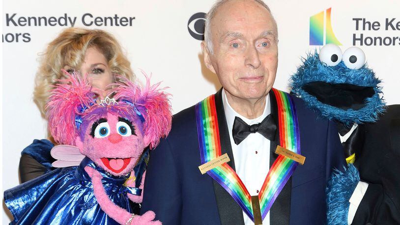FILE - Honoree Lloyd Morrisett appears with muppet characters at the 42nd Annual Kennedy Center Honors at The Kennedy Center, Sunday, Dec. 8, 2019, in Washington. Morrisett, the co-creator of the beloved children's education TV series “Sesame Street,” which uses empathy and fuzzy monsters like Abby Cadabby, Elmo and Cookie Monster to charm and teach generations around the world, has died. He was 93. Morrisett’s death was announced Tuesday by Sesame Workshop, the nonprofit he helped establish under the name the Children’s Television Workshop. (Photo by Greg Allen/Invision/AP, File)