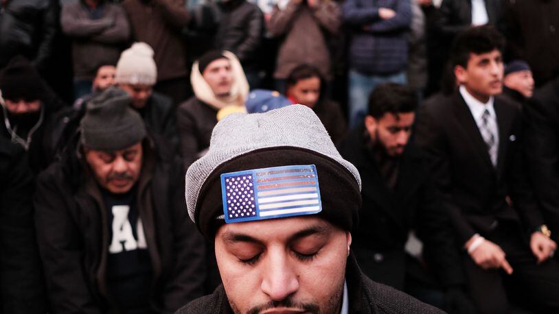 NEW YORK, NY - FEBRUARY 02: Men pray during a protest by ethinic Yemenis and supporters over President Donald Trump's executive order temporarily banning immigrants and refugees from seven Muslim-majority countries, including Yemen on February 2, 2017 in the Brooklyn borough of New York City. At least 1,000 Yemeni-owned bodegas and grocery-stores across the city shut down from noon to 8 p.m. today to protest the order. (Photo by Spencer Platt/Getty Images)