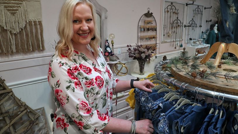 Kari Johnston has been busy getting her new boutique ready for its Nov. 5 opening. The Rose City Boutique is located at 115 East Ward St. and features products from several different local vendors.  BILL LACKEY/STAFF