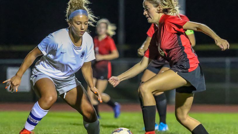 Cutline3: Tecumseh High School senior Mackenzie Chinn dribbles the ball through the Xenia defense during their game at Spitzer Stadium on Monday, Sept. 24. The Arrows are leading the CBC Kenton Trail Division at 6-0-0. CONTRIBUTED PHOTO BY MICHAEL COOPER