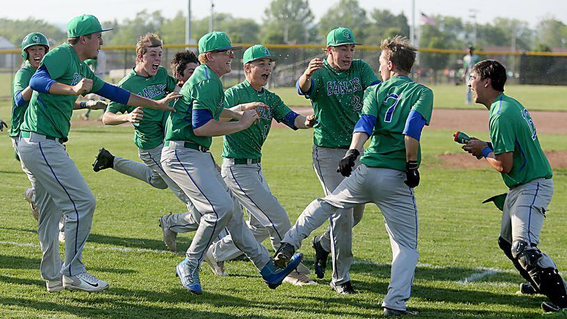Chaminade Julienne celebrates after Mark Barhorst (7) knocked in the winning run against Badin during a D-II sectional baseball final at Miamisburg. Contributed photo by E.L. Hubbard