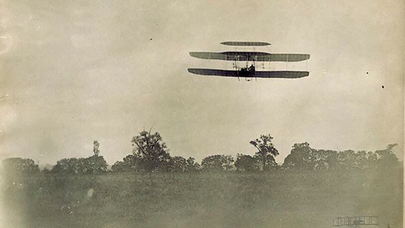 Right front view of Orville Wright piloting the Wright 1905 Flyer during the 23rd flight at Huffman Prairie. The Flyer completed two circles of the field in 2 mins, 45 secs.