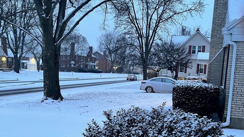 Light snow was falling Friday evening, Jan. 28, 2022, on Shroyer Road in Oakwood.