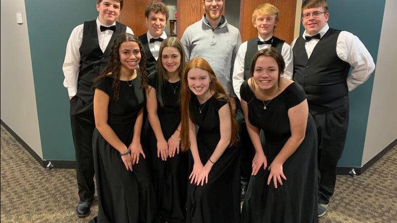 Brice Henry, center, Director of Choirs at West Liberty-Salem Local School District, was named the Springfield Symphony Orchestra’s Music Educator of the Year and will be honored at the Symphony’s concert on Saturday. Courtesy photo