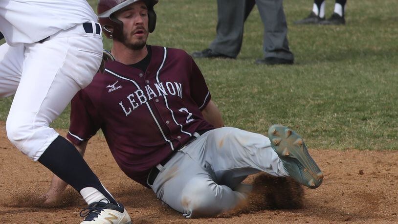 Lebanon’s Austin Harrison slides safely during a game at Springfield. BILL LACKEY/STAFF