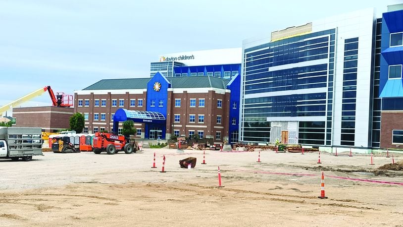Pictured is the ongoing construction outside of Dayton Children’s Hospital on Tuesday, July 26, 2022, which includes work being done for the five-story specialty care outpatient center projected to open in 2023. SAMANTHA WILDOW\STAFF