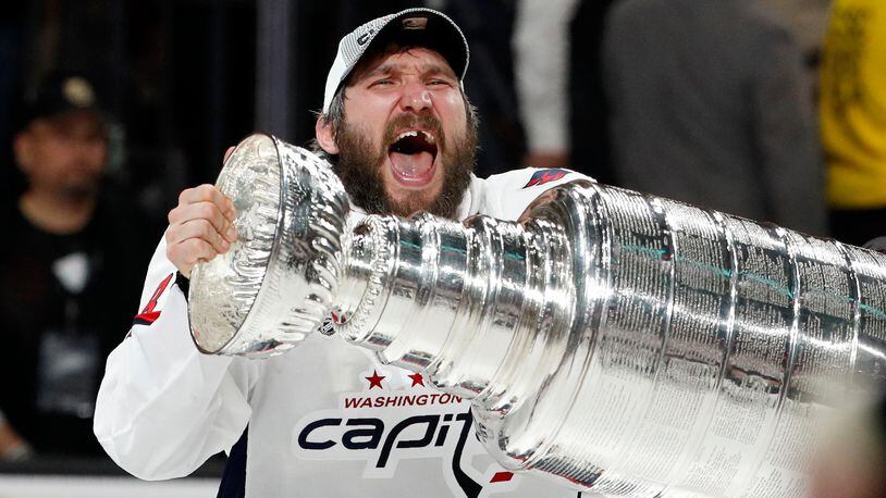 Washington Capitals left wing Alex Ovechkin hoists the Stanley Cup after the Capitals defeated the Golden Knights in Game 5 of the Stanley Cup Finals.